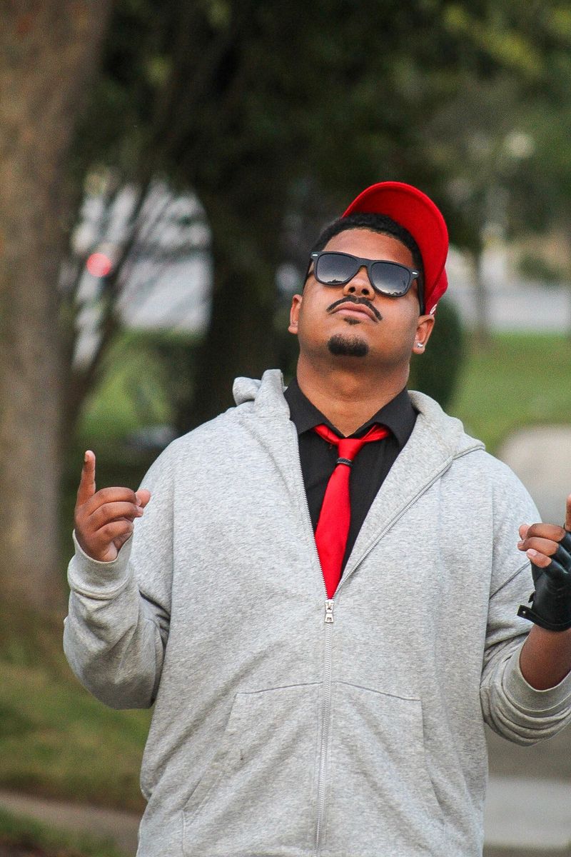 Chuck Wilmore outdoors in a red cap
